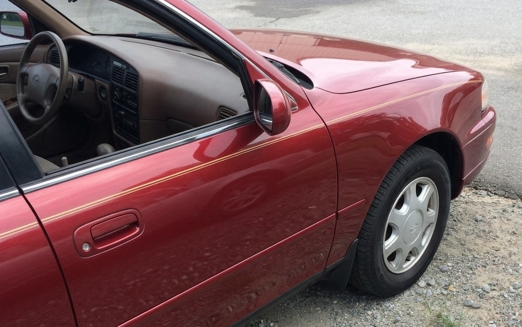 Door panel after dent repair and refinishing